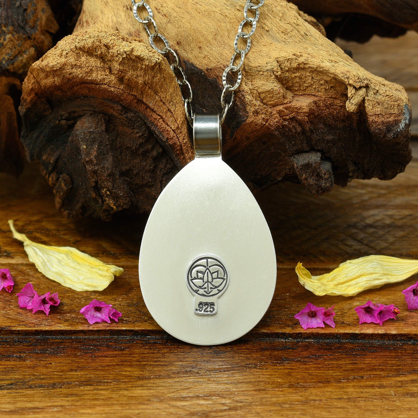 Back of sterling silver cherry blossom and crescent moon necklace with a .925 makers mark.