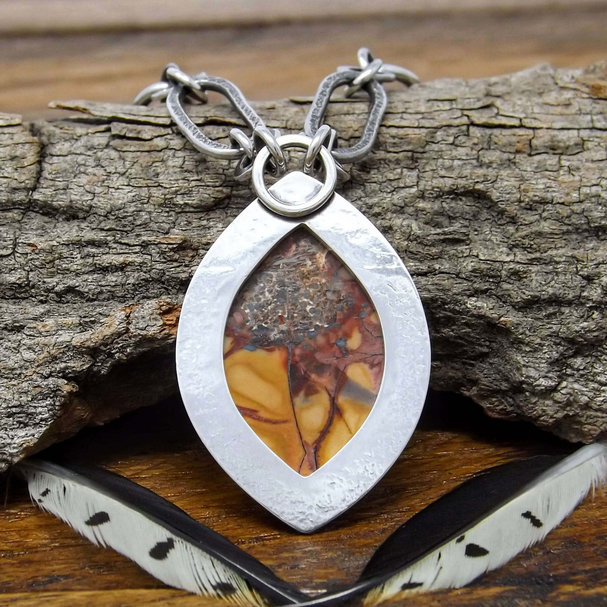 Back view of a sterling silver necklace with a prong set cold mountain jasper gemstone and chunky chain.
