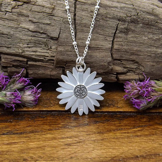Back view of a sterling silver daisy necklace with a .925 makers mark.