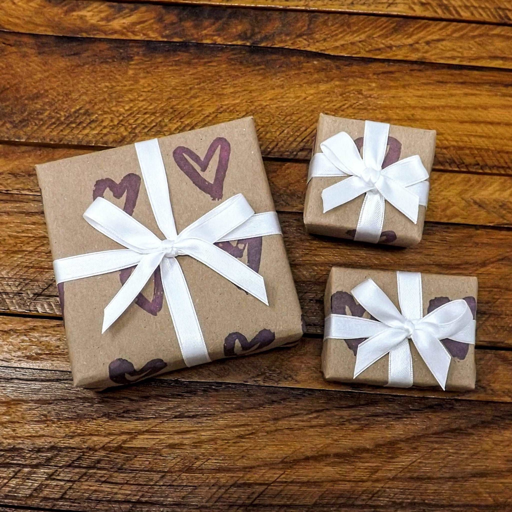 kraft paper purple painted hearts gift wrap with white bow