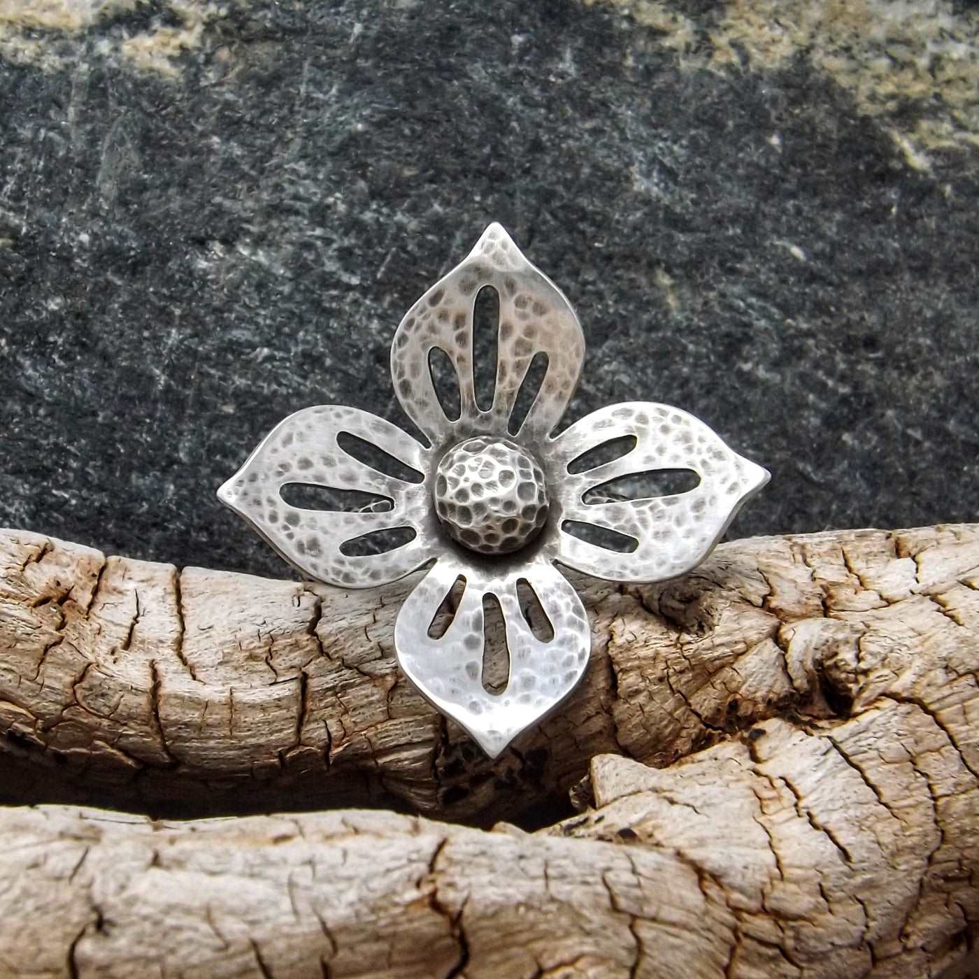 Front view of a one-of-a-kind argentium and sterling silver flower ring.
