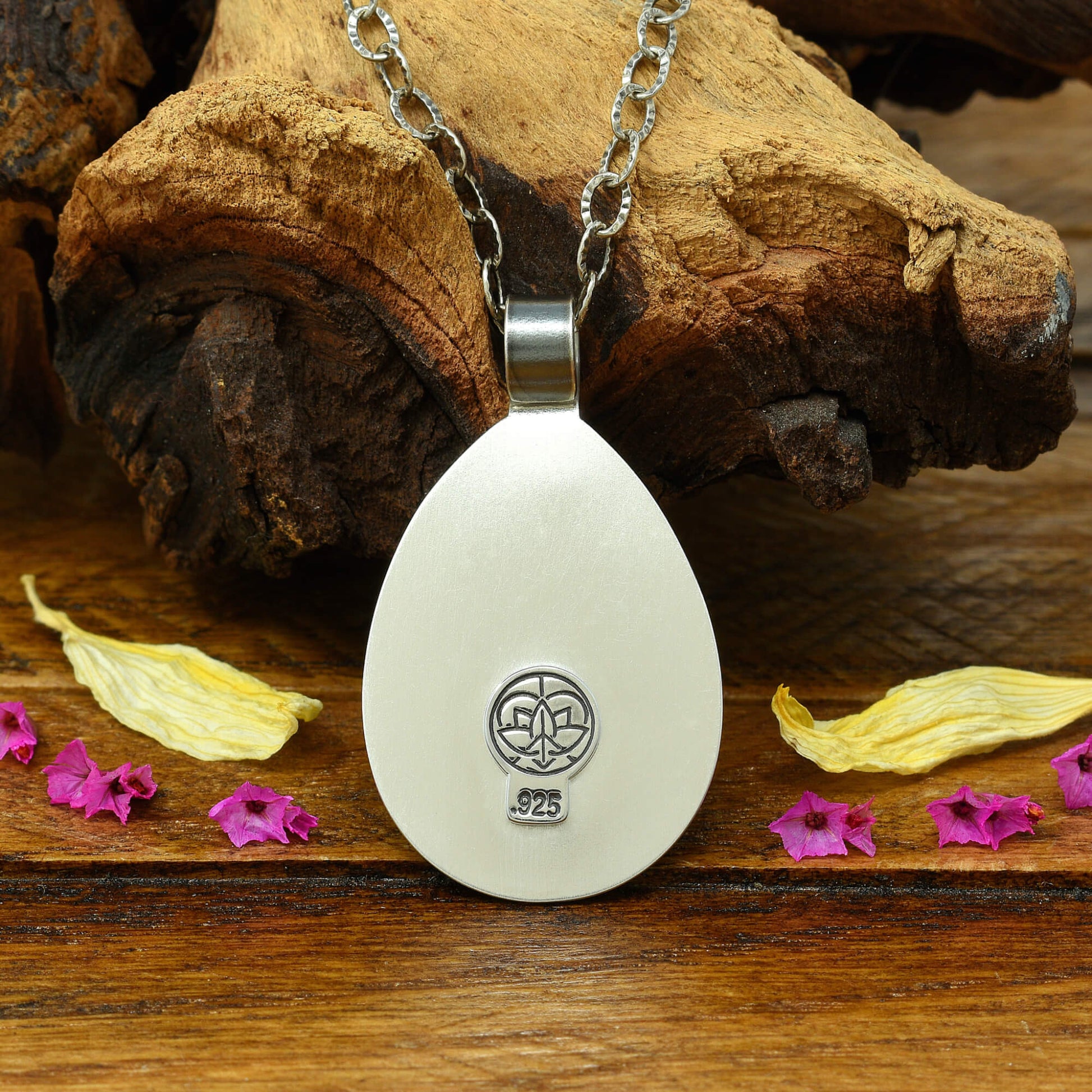 Back of sterling silver cherry blossom and crescent moon necklace with a .925 makers mark.