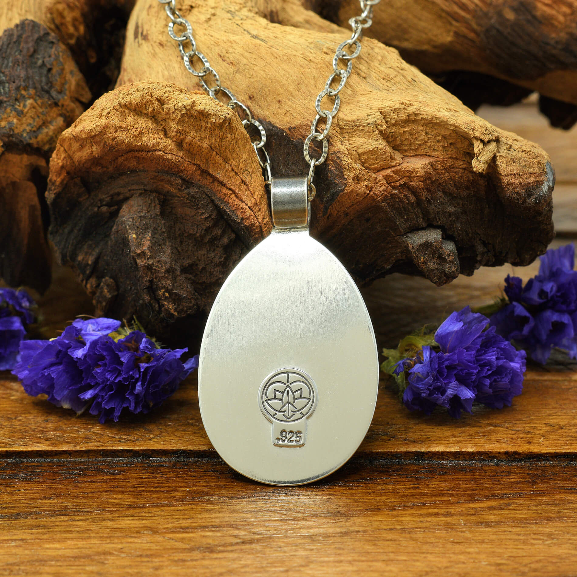 Back view of sterling silver cherry blossom and crescent moon necklace with  .925 makers mark.