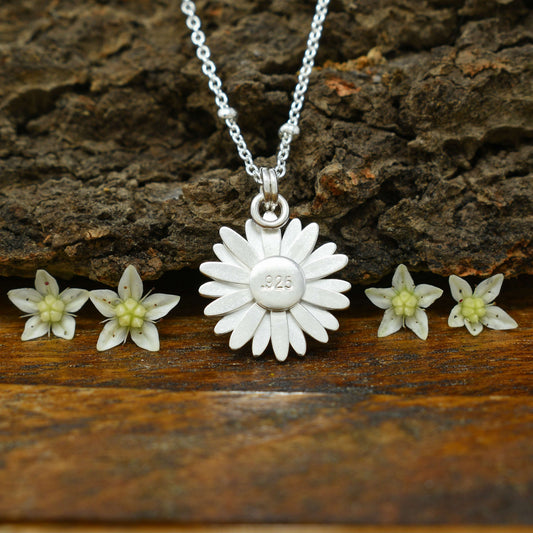 Back view of a sterling silver daisy necklace with .925 hallmarked at the center.